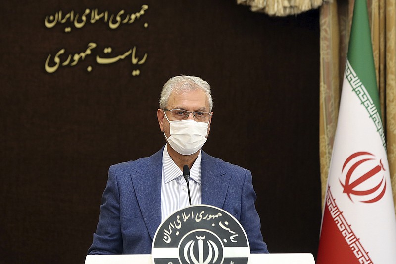 In this photo released by the official website of the office of the Iranian Presidency, cabinet spokesman Ali Rabiei speaks at his weekly press briefing in Tehran, Iran, Tuesday, July 6, 2021. Rabiei on Tuesday accused Israel of a sabotage attack in June that reportedly targeted a civilian nuclear facility near Tehran, the official IRNA news agency reported. (Iranian Presidency Office via AP)