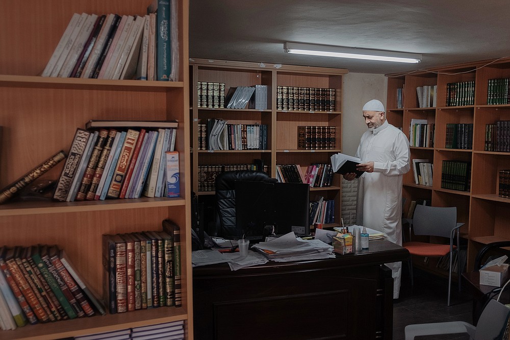 Sheikh Raed Bader, a follower and spiritual successor of Sheikh Abdullah, at his office in Kafr Qasim, Israel on June 26, 2021. Bader, one of Sheikh Abdullah Nimr Darwish’s spiritual successors, who are fighting to restore momentum to a formal peace process that petered out in 2014. The inclusion of an Islamist party in Israel’s government has spurred a group of imams and rabbis hoping to build a religious-based peace movement. (Amit Elkayam/The New York Times)