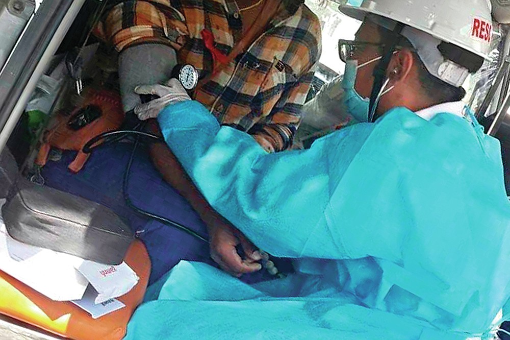 In this March 5, 2021 photo obtained by The Associated Press, Dr. Nay Lin Tun tends to a patient wounded in a protest in Yangon, Myanmar. “In other country’s protests, the medics are safe. They are exempt. Here, there are no exemptions,” says the general practitioner who has been on the run since February, and now provides care covertly. (AP Photo)