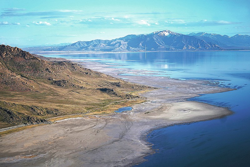 The Great Salt Lake recedes from Anthelope Island on May 4, 2021, near Salt Lake City. The lake has been shrinking for years, and a drought gripping the American West could make this year the worst yet. The receding water is already affecting nesting pelicans that are among millions of birds dependent on the largest natural lake west of the Mississippi River. (AP Photo/Rick Bowmer)
