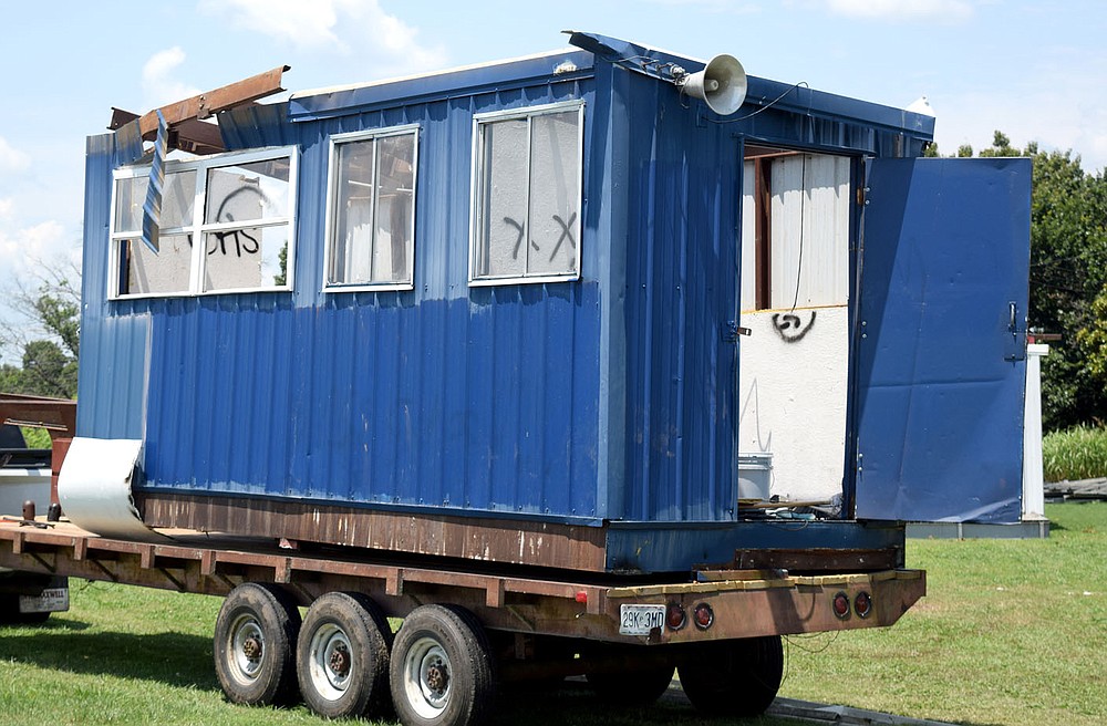 Westside Eagle Observer/MIKE ECKELS
The old press box at Bulldog Stadium in Decatur is loaded on a trailer ready for the scrap yard July 7. The 31 plus year old structure will soon be replaced with an aluminum press box and bleachers purchased from the Farmington School District in late May.