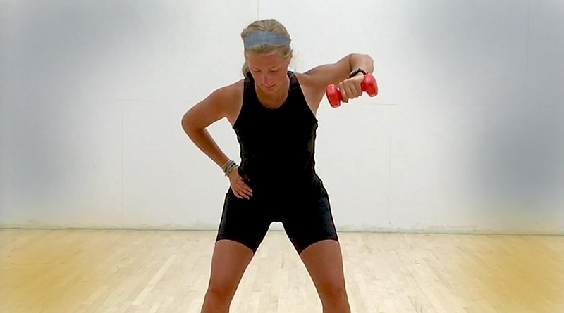 Meredith Pinkston demonstrates the Anti-Rotation Row on a racquetball court at Little Rock Athletic Club. (Arkansas Democrat-Gazette photo illustration/Celia Storey)