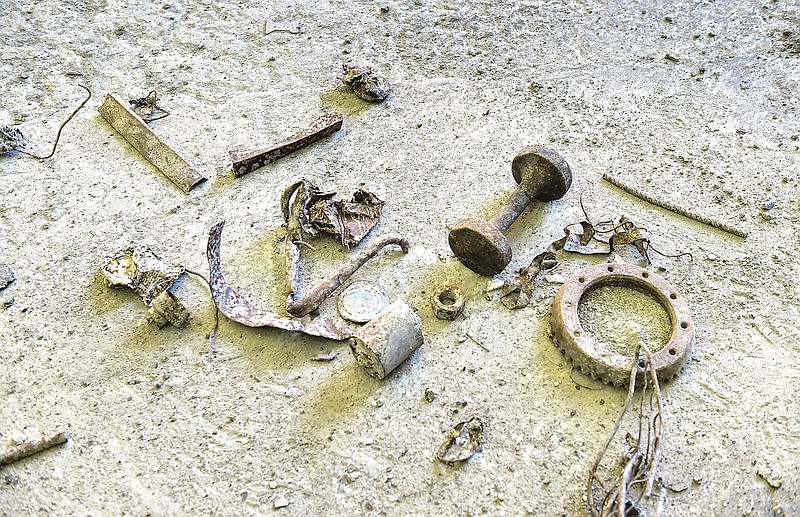 Debris and metal that went through the Lancaster County Solid Waste Management Authority's incinerator, is pictured on the floor beside a pit at the waste-to-energy facility in Bainbridge, Pa., on Wednesday, June 16, 2021. (Suzette Wenger/LNP/LancasterOnline via AP)