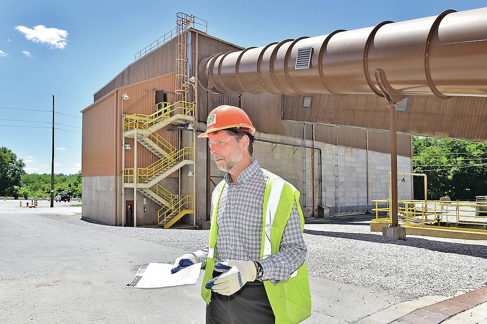 Bob Zorbaugh, CEO of the Lancaster County Solid Waste Management Authroity, speals between two sections of the waste-to-energy production facility in Bainbridge, Pa., on Wednesday, June 16, 2021. (Suzette Wenger/LNP/LancasterOnline via AP)