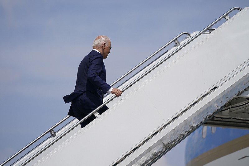 President Joe Biden boards Air Force One at O'Hare International Airport, Wednesday, July 7, 2021, in Chicago. (AP Photo/Evan Vucci)