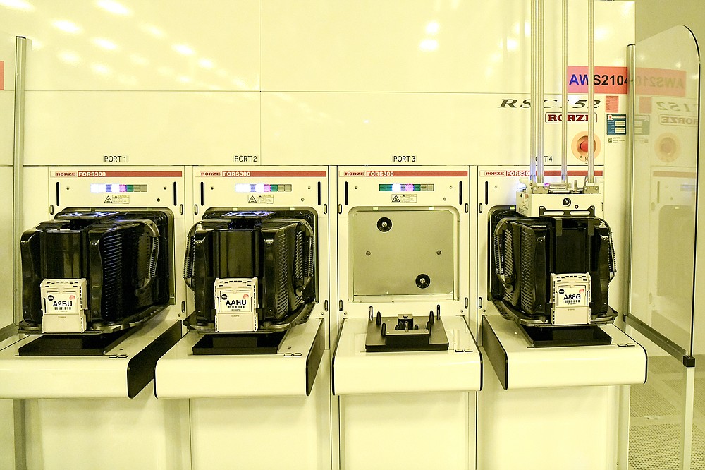 Containers holding printed silicone wafers are parked in ports until they are transported to another area in the clean room at GlobalFoundries Fab 8. MUST CREDIT: Photo for The Washington Post by Cindy Schultz