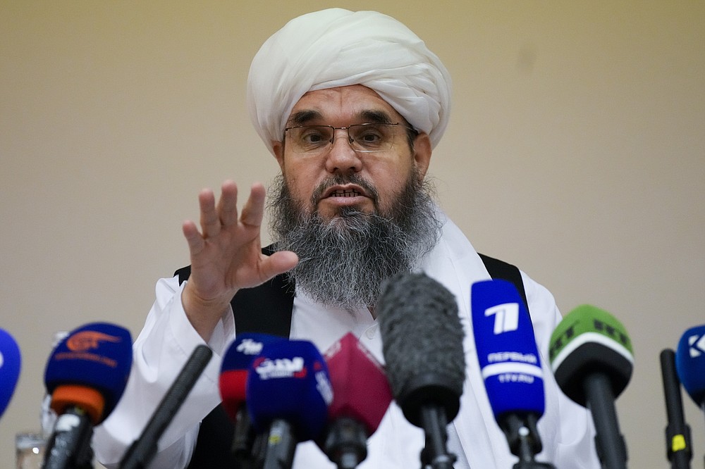 Mawlawi Shahabuddin Dilawar, member of political delegation from the Afghan Taliban's movement gestures during a news conference in Moscow, Russia, Friday, July 9, 2021. (AP Photo/Alexander Zemlianichenko)