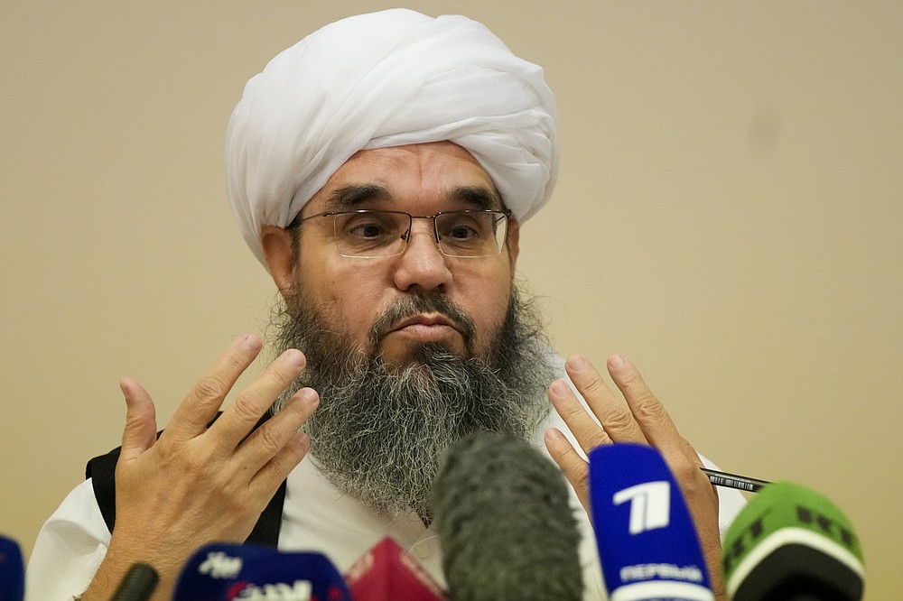 Mawlawi Shahabuddin Dilawar, member of political delegation from the Afghan Taliban's movement gestures during a news conference in Moscow, Russia, Friday, July 9, 2021. (AP Photo/Alexander Zemlianichenko)