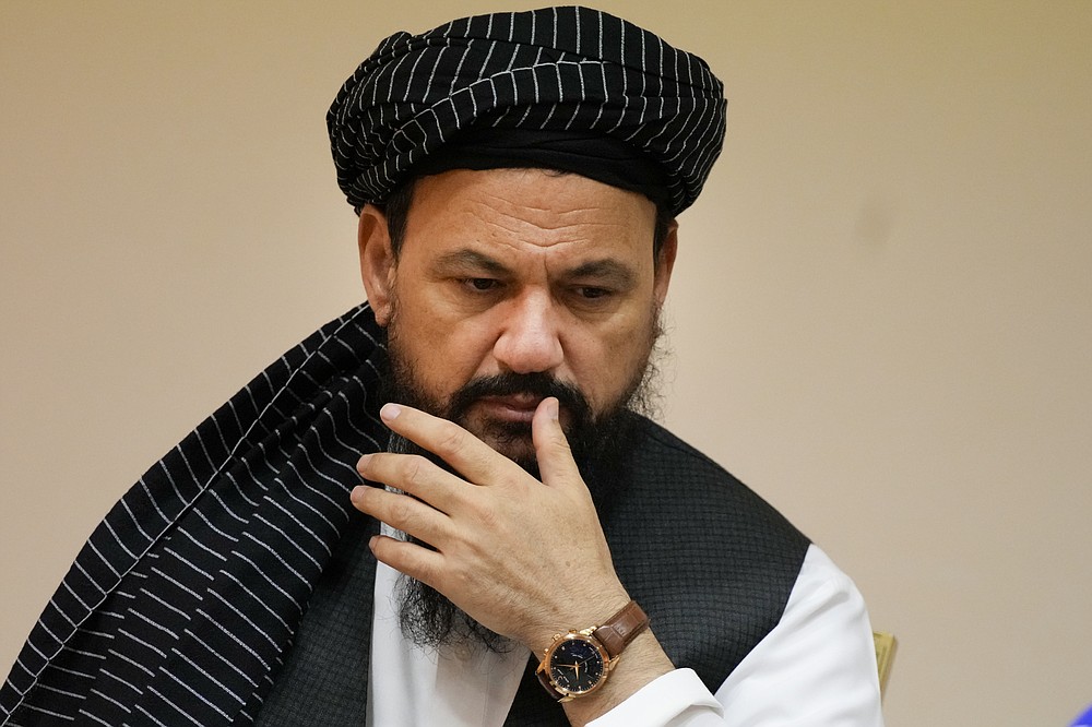 Dr, Mohammad Naim, members of political delegation from the Afghan Taliban's movement attends a news conference in Moscow, Russia, Friday, July 9, 2021. (AP Photo/Alexander Zemlianichenko)