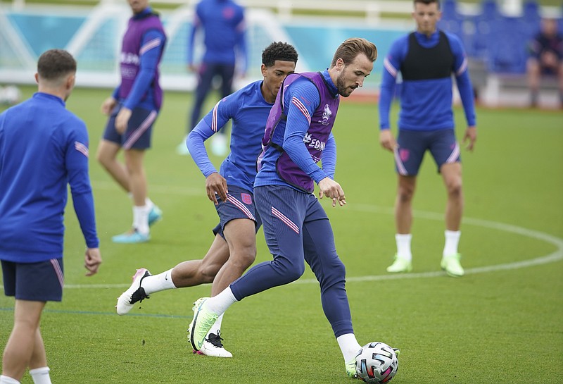 England's Harry Kane is challenged by Jude Bellingham during a training session at St George's Park, Burton upon Trent, England, Saturday July 10, 2021, ahead of their Euro 2020 soccer championship final match against Italy at Wembley Stadium on Sunday. (AP Photo/Dave Thompson)