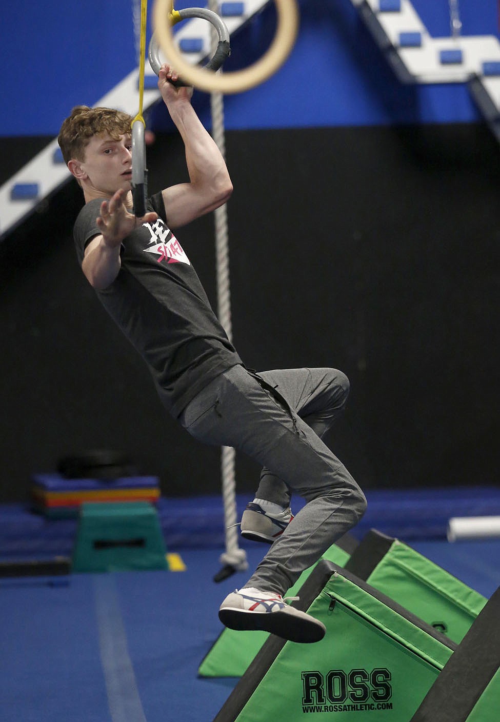 Bentonville West High School student Owen Dyer, 16, a competitor in the new Ninja Warrior's teen category reaches for a hoop as he trains Tuesday, July 6, 2021, at Flip Side Ninja Park Lowell. Check out nwaonline.com/210711Daily/ and nwadg.com/photos for a photo gallery.(NWA Democrat-Gazette/David Gottschalk)