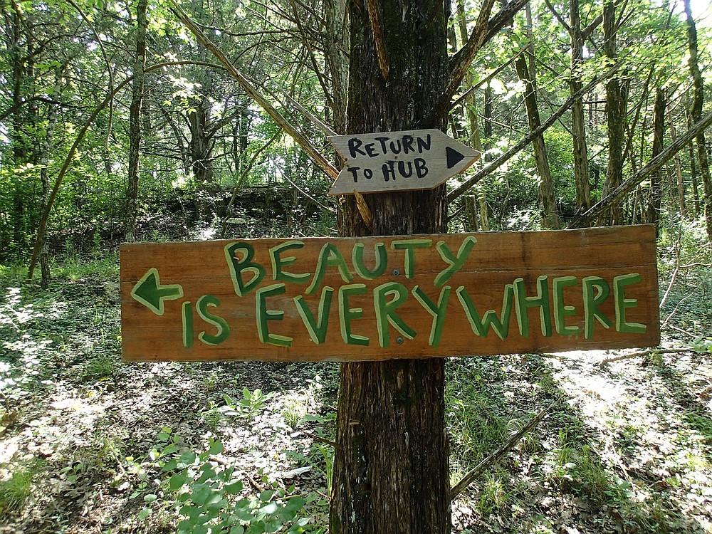 Hand-painted wood signs guide riders along the varies loops of the Marble Flats trails. Routes are laid out for beginner, intermediate and expert riders.
(NWA Democrat-Gazette/Flip Putthoff)
