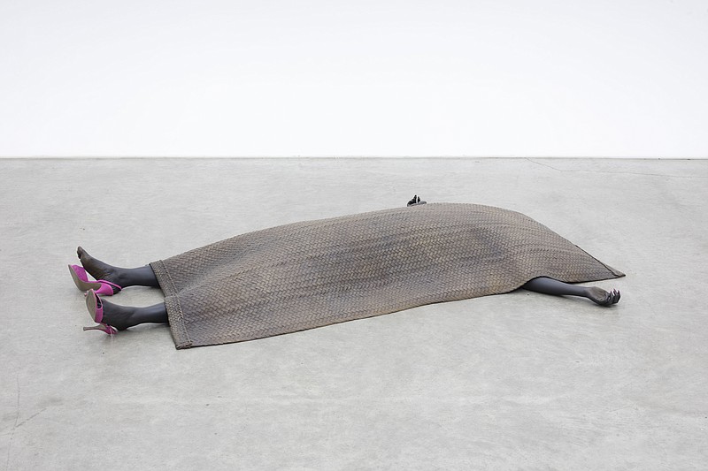 Wangechi Mutu’s “Shavasana II” is one of two sculptures of two Black women whose arms and legs stick out from the tarp that covers them. The artist says the works embody the continuing suffering of Black people around the world, especially women. (Courtesy of Wangechi Mutu and Gladstone Gallery Fine Arts Museums of San Francisco)