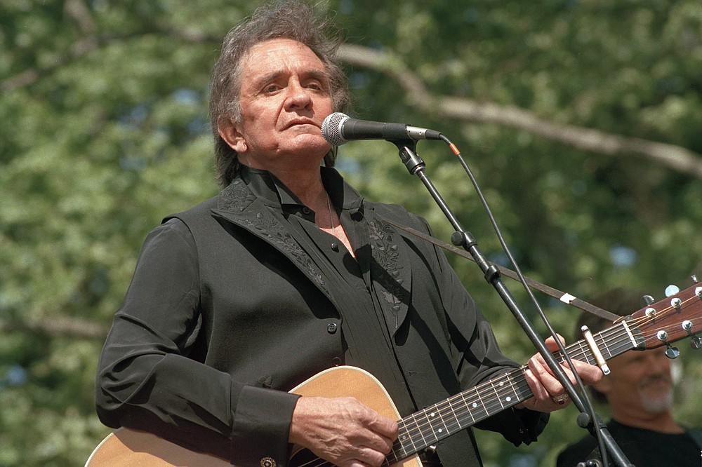 Country legend Johnny Cash performs on May 23, 1993, at a benefit concert at Central Park in New York. Cash died Sept. 12, 2003. (AP file photo)