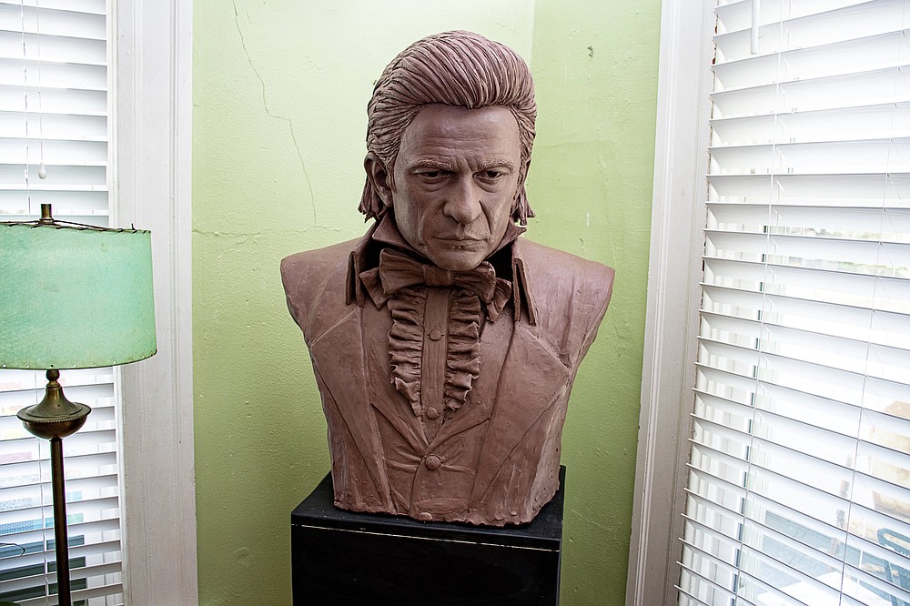 A life-size clay bust of Johnny Cash is one of three Cash likenesses adorning the home of Kevin Kresse. Kresse is creating a statue of Cash for inclusion in the U.S. Capitol. For Kresse, a Natural State artist and a Cash fan, it’s the dream of a lifetime. (Arkansas Democrat-Gazette/Cary Jenkins)