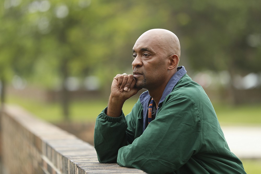 Crosby Smith, care provider at Ludeman Developmental Center, a state home for the developmentally disabled, poses for a portrait near the center premise, Thursday, July 8, 2021 in Park Forest, Ill. Smith and his fiancee were among numerous staff and residents at the Ludeman Developmental Center who contracted the virus last year. He said the hazard money helped pay down credit cards and avoid further debt when buying clothing and shoes. (AP Photo/Shafkat Anowar)