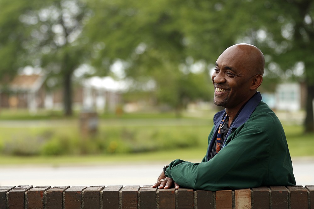 Crosby Smith, care provider at Ludeman Developmental Center, a state home for the developmentally disabled, poses for a portrait near the center premise, Thursday, July 8, 2021 in Park Forest, Ill. Smith and his fiancee were among numerous staff and residents at the Ludeman Developmental Center who contracted the virus last year. He said the hazard money helped pay down credit cards and avoid further debt when buying clothing and shoes. (AP Photo/Shafkat Anowar)