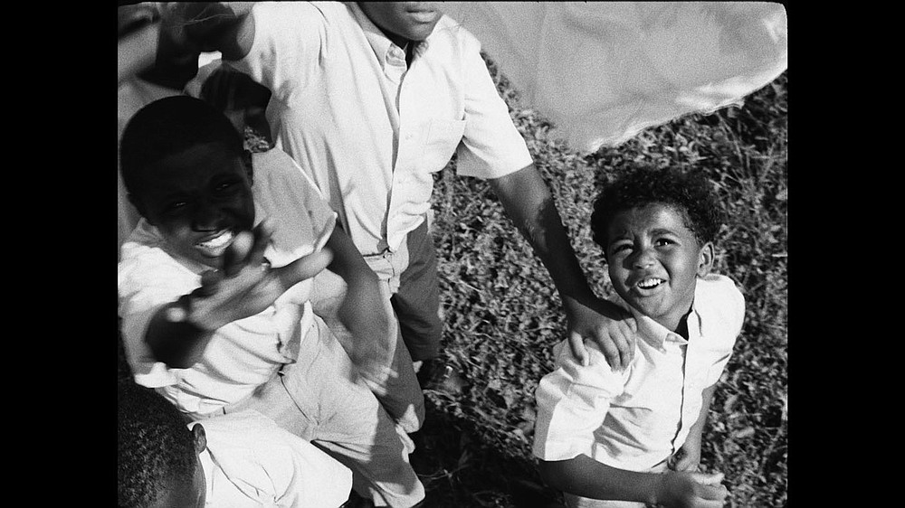 The pleasant visuals in Garrett Bradley’s video installation “America” challenge viewers “to consider what it might mean to see Black representation through a lens that privileges depictions of pleasure over spectacles of pain,” the Momentary press release explains.
“America” film still. Multi-channel video installation; 35mm film transferred to video: black and white, sound. 23:55 minutes.
(Courtesy Image/Garrett Bradley)
