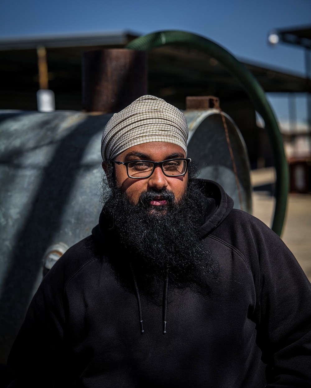 Simranjit Singh at the family farm in Kerman, Calif. where his family grows a raisins and almonds, March 23, 2021. In California, a young generation of Sikh farmers has agricultural roots that stretch back 900 years. (Ryan Christopher Jones/The New York Times)