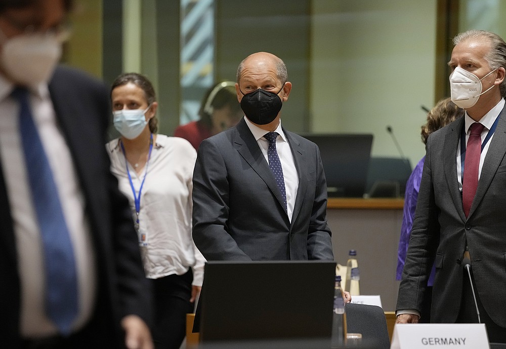 German Finance Minister Olaf Scholz, center, attends a meeting of Eurogroup finance ministers in the European Council building in Brussels on Monday, July 12, 2021 (AP Photo / Virginia Mayo)