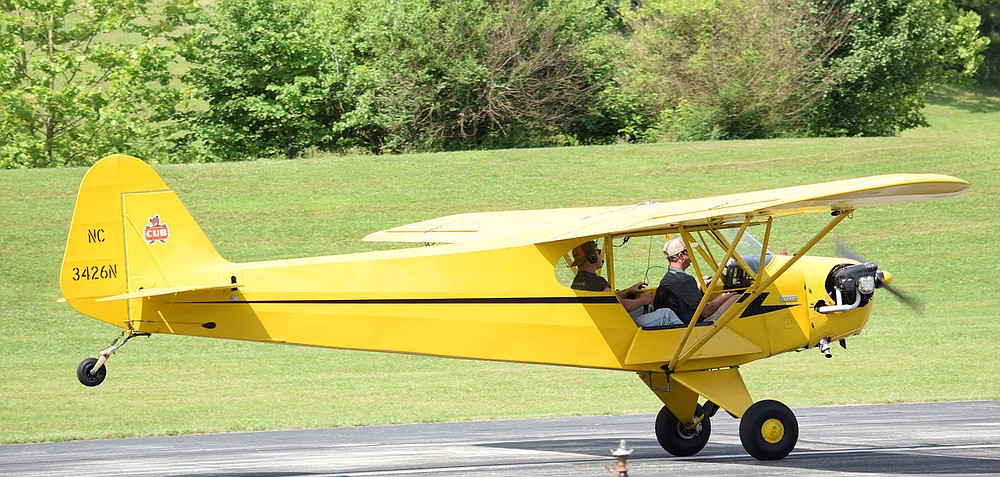 Westside Eagle Observer/MIKE ECKELS
A vintage Piper J-3 Cub, owned by Summit Aviation in Bentonville, rolls down runway 31 at Crystal Lake Airport Thursday morning with a student pilot at the controls. This particular aircraft used Crystal Lake Airport several times during the week giving lessons to students and check rides to current pilots.