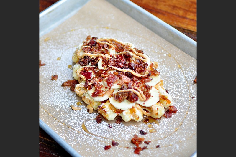 The Elvis Waffle at Press Waffle Co. features sliced bananas, peanut butter, honey and bacon crumble. (Special to the Democrat-Gazette)