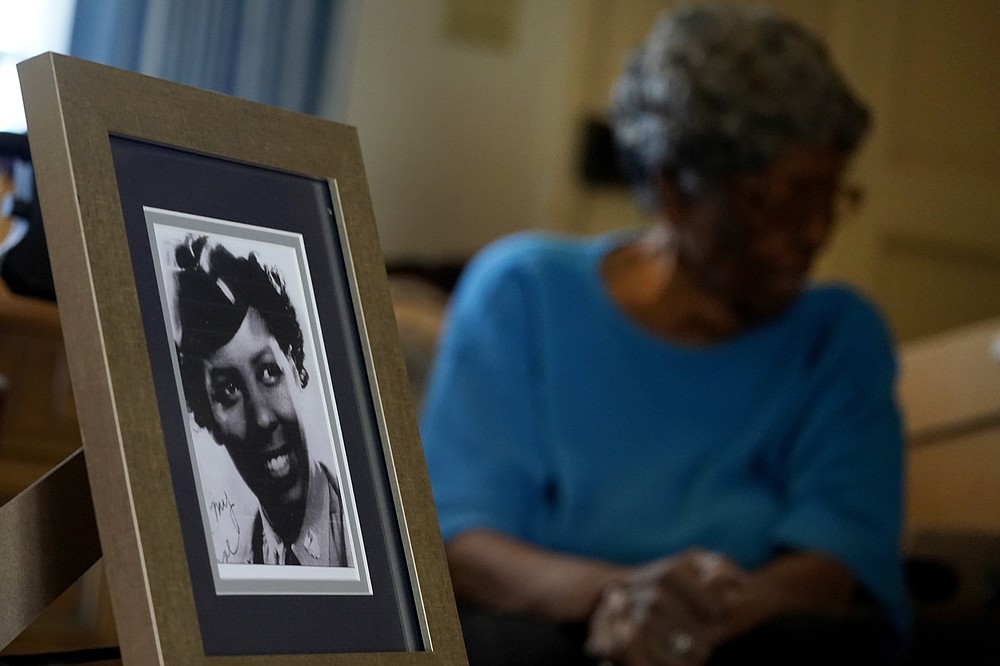 CORRECTS NAME OF BATTALION - World War II veteran Maj. Fannie Griffin McClendon shows an image of herself during her time in the military, at her home Thursday, June 10, 2021, in Tempe, Ariz. McClendon had a storied history as a member of the 6888th Central Postal Directory Battalion that made history as being the only all-female, black unit to serve in Europe during World War II. (AP Photo/Matt York)