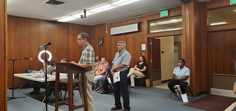 Photo by Bradly Gill
Ralph Wilcox, left, National Register and Historic Survey Coordinator and Tom Marr, federal program and tax credit manager, speak to the Camden City Council about the Arkansas Historic Preservation Program.