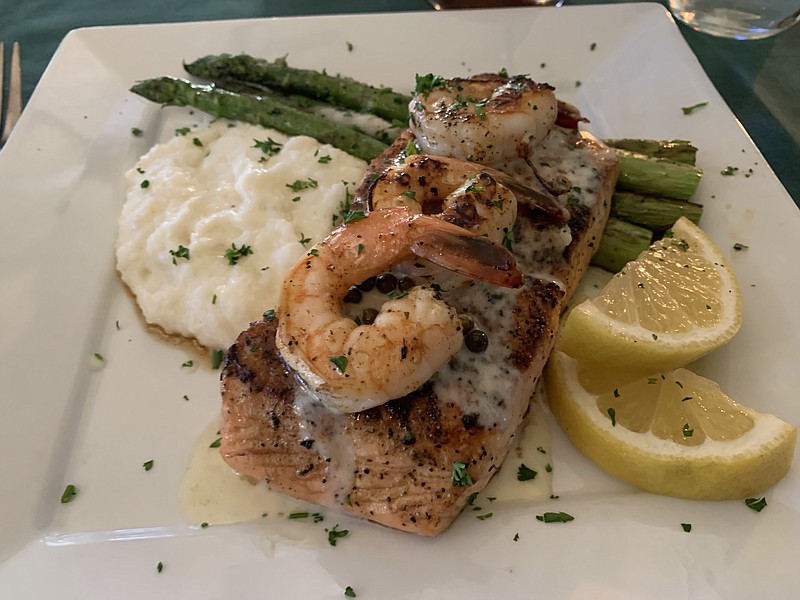 Three shrimp and a citrus beurre blanc garnish the salmon entree (with side asparagus and cheese grits — really) at Walter's Green Room, attached to the Heights Corner Market in Little Rock's Pulaski Heights. (Arkansas Democrat-Gazette/Eric E. Harrison)
