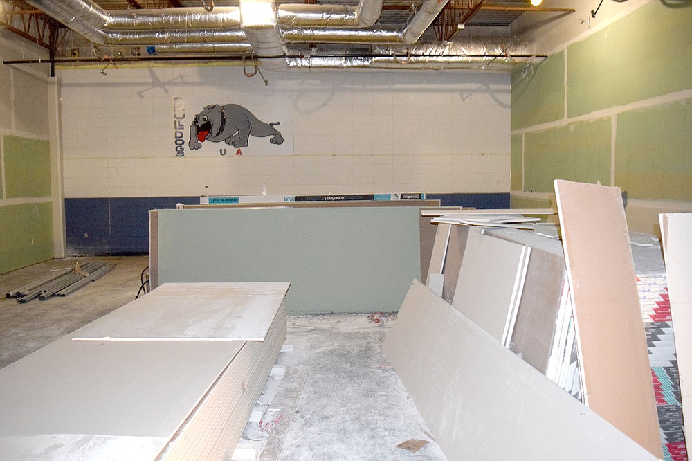 Westside Eagle Observer/MIKE ECKELS
The familiar Bulldog painting that at one time greeted junior and senior high school students during lunch will soon become a symbol for the high school band. School board members toured the new band room July 13 to see the progress made so far on the Decatur High School renovation project.