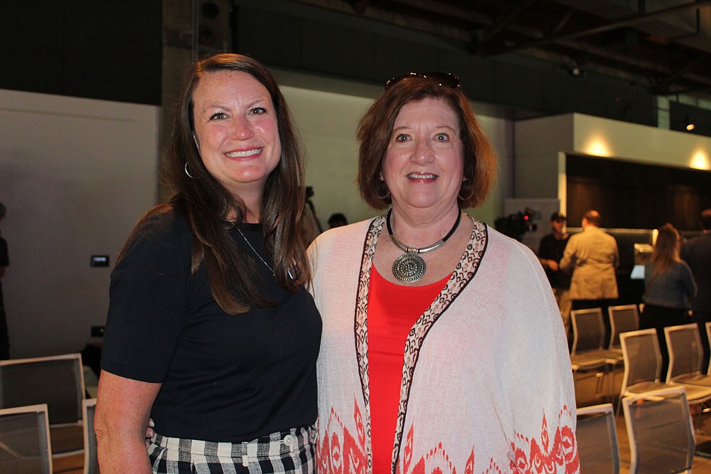 Brittney Duke (left) and Karen Parker celebrate with SPSFNWA.
(NWA Democrat-Gazette/Carin Schoppmeyer)