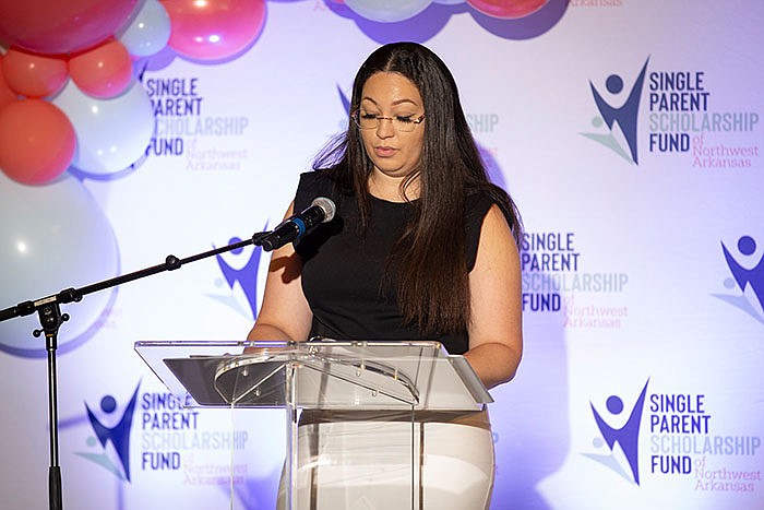 Hillary Bell, scholarship recipient, speaks to SPSFNWA backers at the merger celebration.
(Courtesy photo)