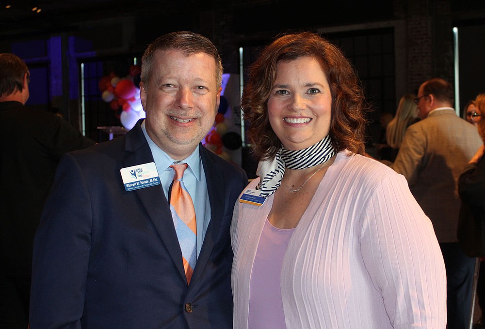 Steven and Christina Hinds stand for a photo at the merger celebration.
(NWA Democrat-Gazette/Carin Schoppmeyer)