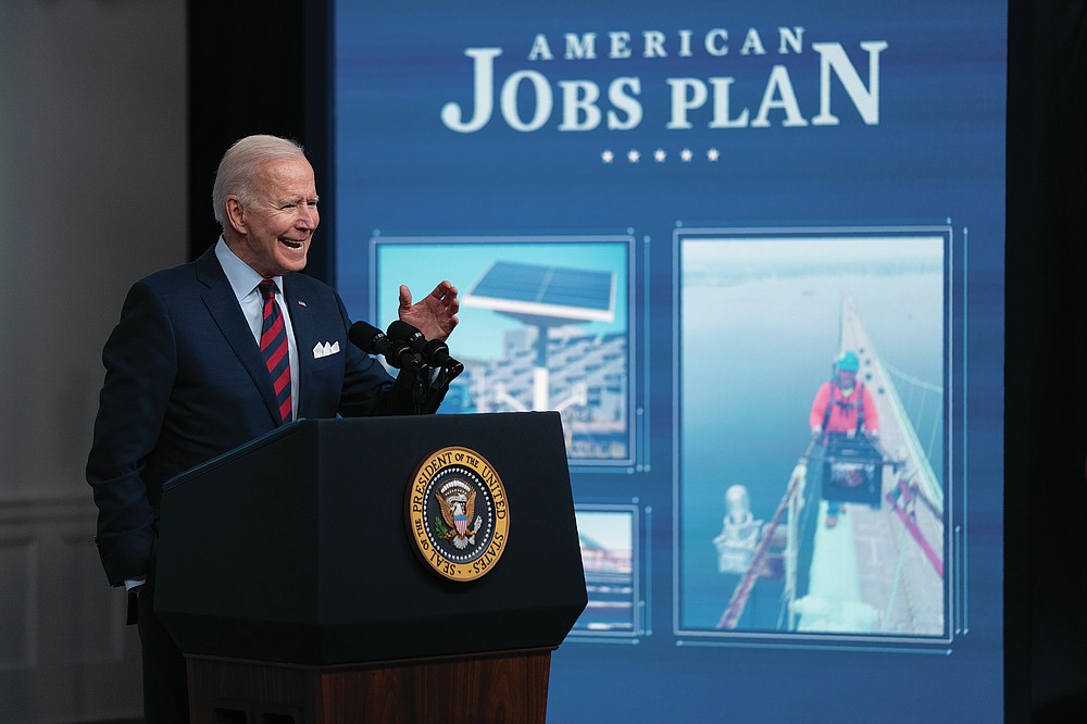 FILE - In this Wednesday, April 7, 2021 file photo, President Joe Biden speaks during an event on the American Jobs Plan in the South Court Auditorium on the White House campus in Washington. On Friday, July 16, 2021, The Associated Press reported on stories circulating online incorrectly asserting less than 5 cents of every dollar of the $4 trillion “infrastructure” bill actually goes to infrastructure. But Biden’s $4 trillion plan is actually made up of two distinct bill proposals: the American Jobs Plan and the American Families Plan. The former is a $2.3 trillion package for hard infrastructure items, while the latter is a companion bill of roughly equal size for soft infrastructure items like investments in child care, family tax credits and other domestic programs. (AP Photo/Evan Vucci, File)
