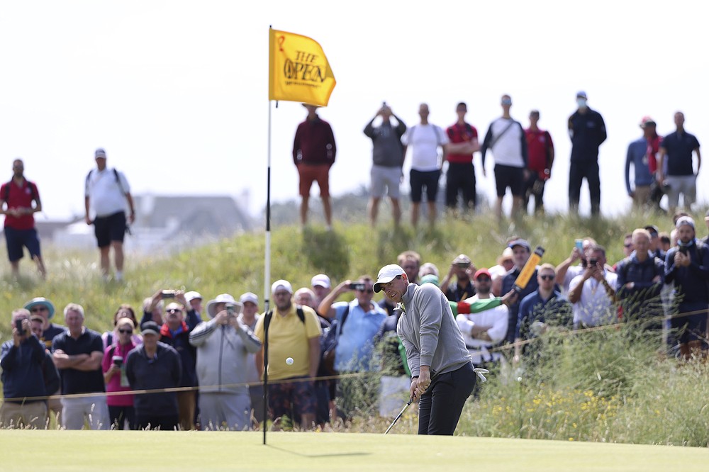 Northern Ireland's Rory McIlroy chips onto the 2nd green during the second round of the British Open Golf Championship at Royal St George's golf course Sandwich, England, Friday, July 16, 2021. (AP Photo/Ian Walton)
