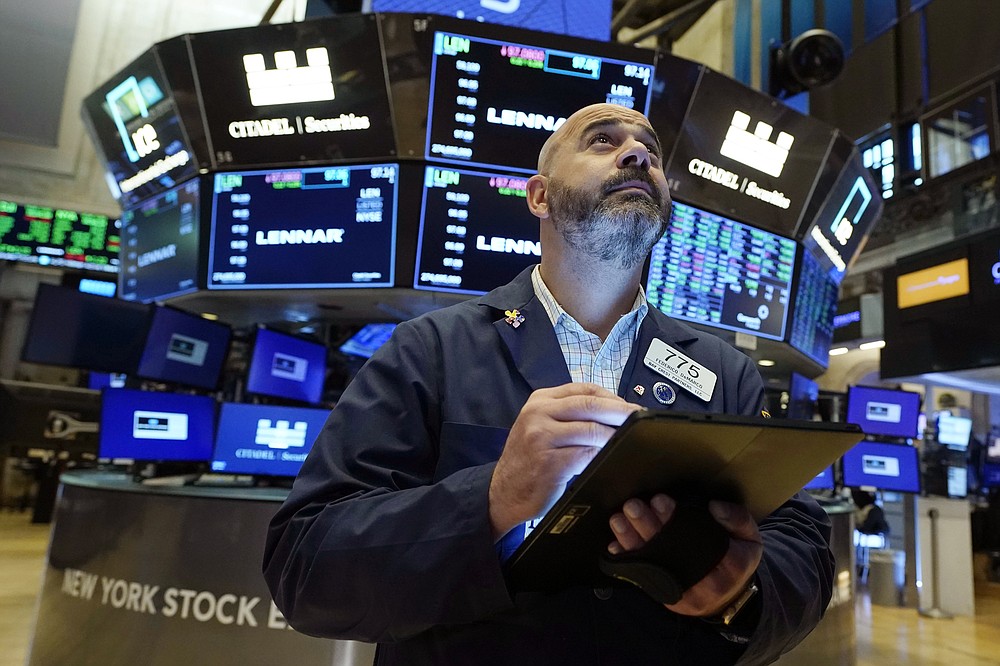 Trader Fred DeMarco works on the floor of the New York Stock Exchange, Friday, July 16, 2021. Stocks are off to a slightly higher start on Wall Street Friday with an assist from several big technology companies. (AP Photo/Richard Drew)