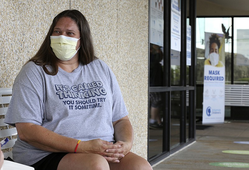 Angela Morris of Sidney talks about her child’s battle with covid-19 Thursday, outside Arkansas Children’s Hospital in Little Rock. Morris said she is overwhelmed with guilt for not getting vaccinated.
(Arkansas Democrat-Gazette/Thomas Metthe