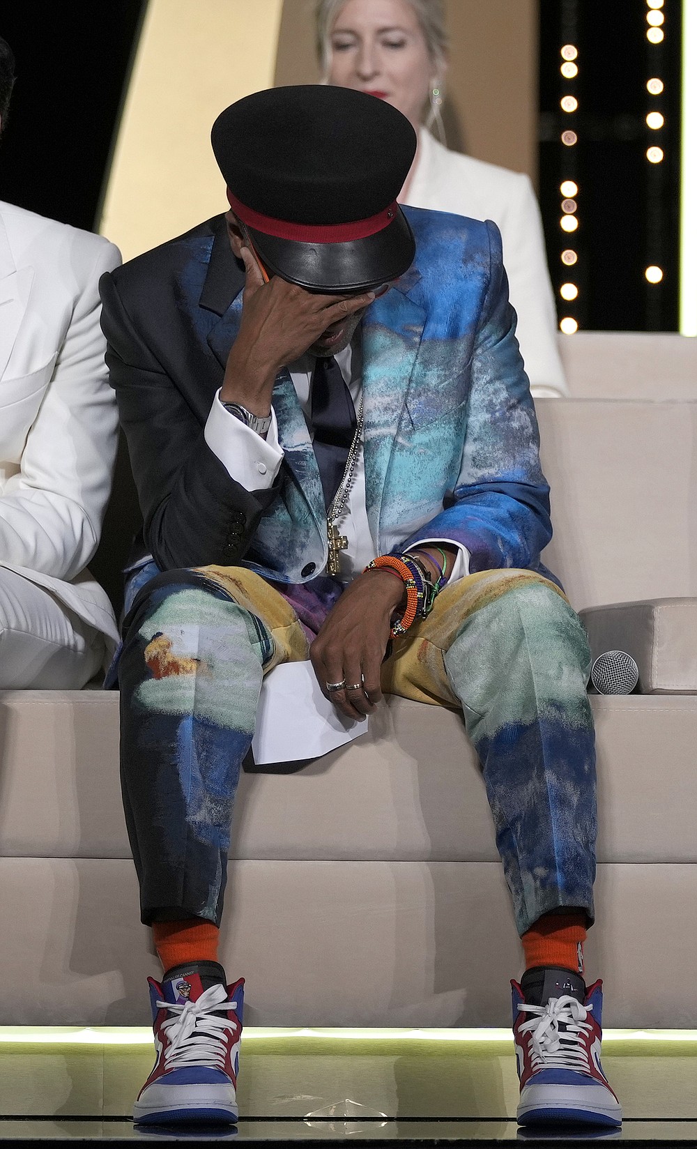 Jury president Spike Lee holds his head in hands after accidentally revealing the film 'Titane' as the winner of the Palme d'Or during the awards ceremony at the 74th international film festival, Cannes, southern France, Saturday, July 17, 2021. (AP Photo/Vadim Ghirda)