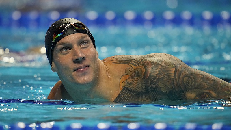 FILE - In this June 20, 2021, file photo, Caeleb Dressel reacts after the men's 50-meter freestyle during wave 2 of the U.S. Olympic Swim Trials in Omaha, Neb. For a man tabbed as swimming’s next superstar, Dressel could not be more disinterested. Of course, he cares about being fast in the pool. He just is not into anyone else’s expectations or comparisons. Fame is not his thing, either. (AP Photo/Jeff Roberson, File)