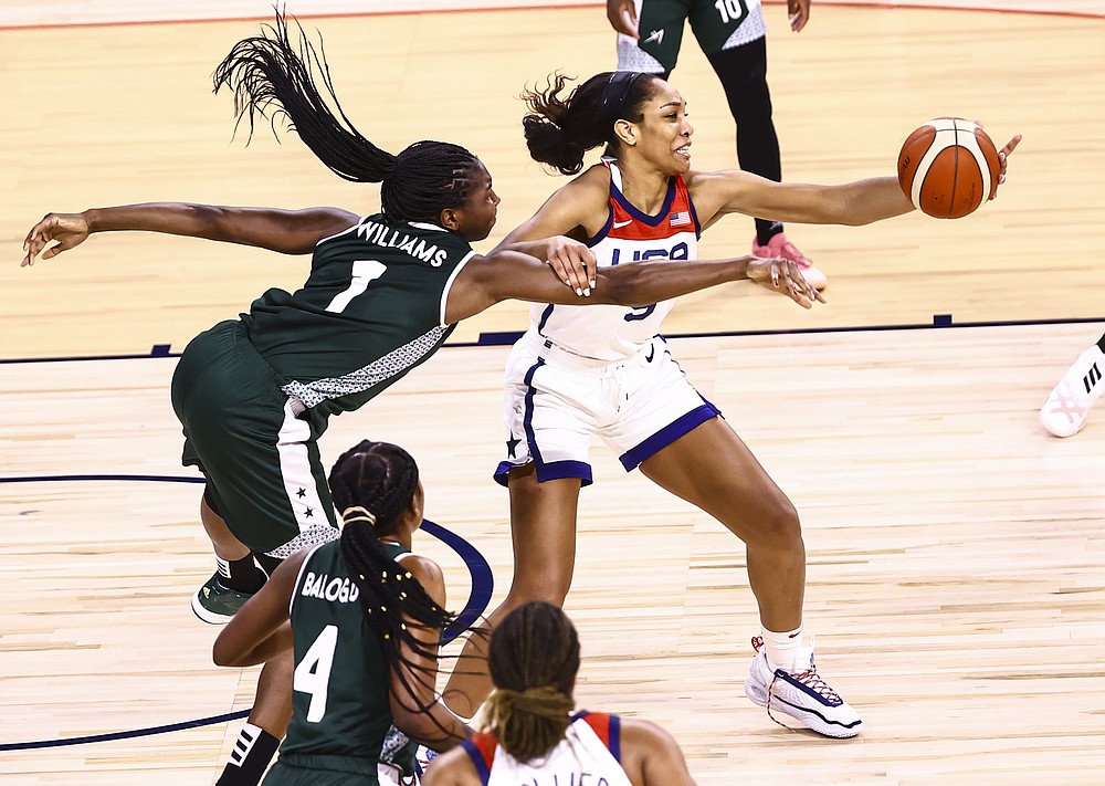 Nigeria forward/center Elizabeth Williams (1) battles for the ball against United States forward A'Ja Wilson during the first half of a pre-Olympic exhibition basketball game in Las Vegas on Sunday, July 18, 2021. (Chase Stevens/Las Vegas Review-Journal via AP)