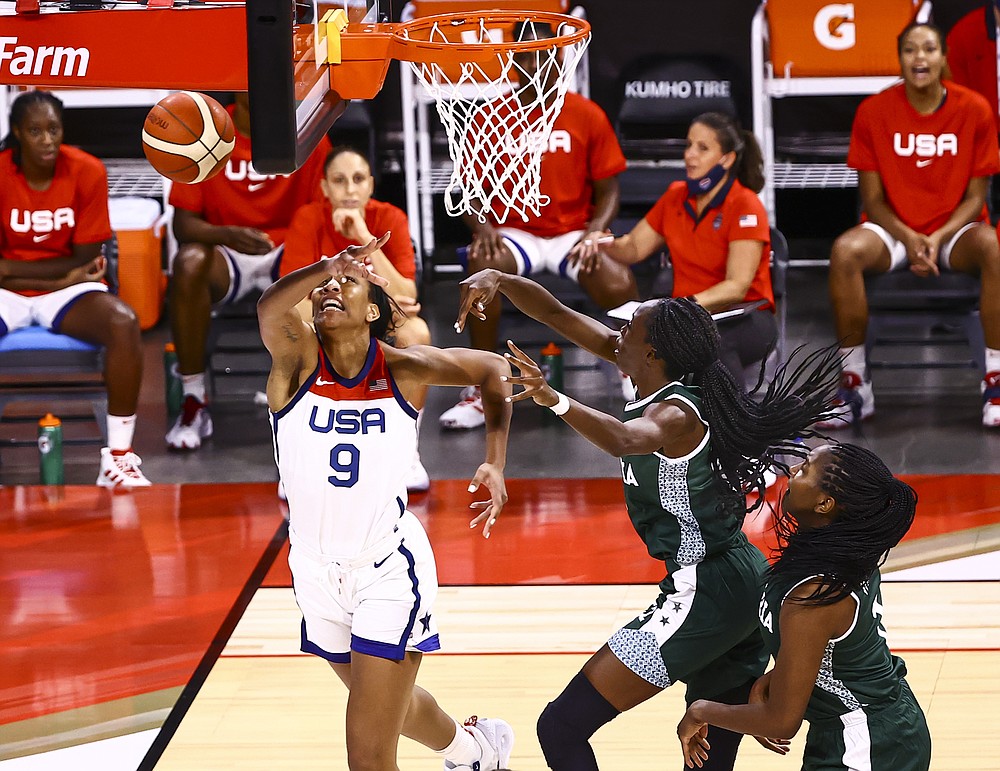 Nigeria guard Ifunanya Ibekwe, center right, blocks a shot from United States forward A'Ja Wilson (9) during the first half of a pre-Olympic exhibition basketball game in Las Vegas on Sunday, July 18, 2021. (Chase Stevens/Las Vegas Review-Journal via AP)