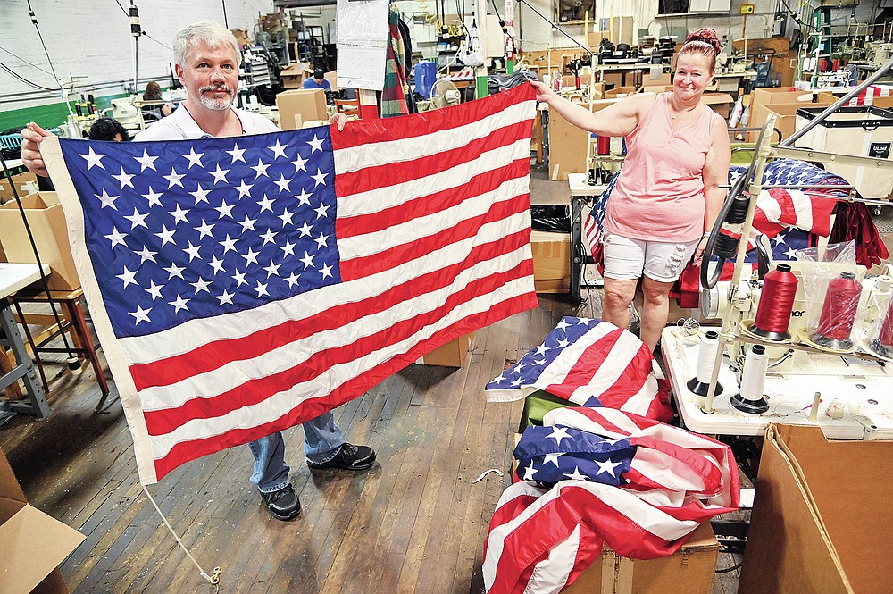 Sewing stars and stripes American flags manufactured in Pennsylvania