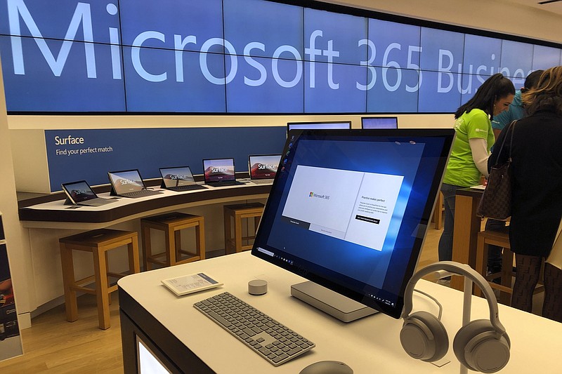 FILE - In this Jan. 28, 2020, file photo, a Microsoft computer is among items displayed at a Microsoft store in suburban Boston. The Biden administration on Monday, July 19, 2021, blamed China for a hack of Microsoft Exchange email server software that compromised tens of thousands of computers around the world earlier in the year. (AP Photo/Steven Senne, File