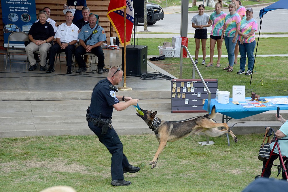 Graham Thomas/Herald-Leader
Police officer Corey Jackson and K9 Lorde give a demonstration Saturday at the "Celebrating Siloam Springs First Responders" program hosted by the Siloam Springs Rotary Club at the Chautauqua Amphitheater in Memorial Park.