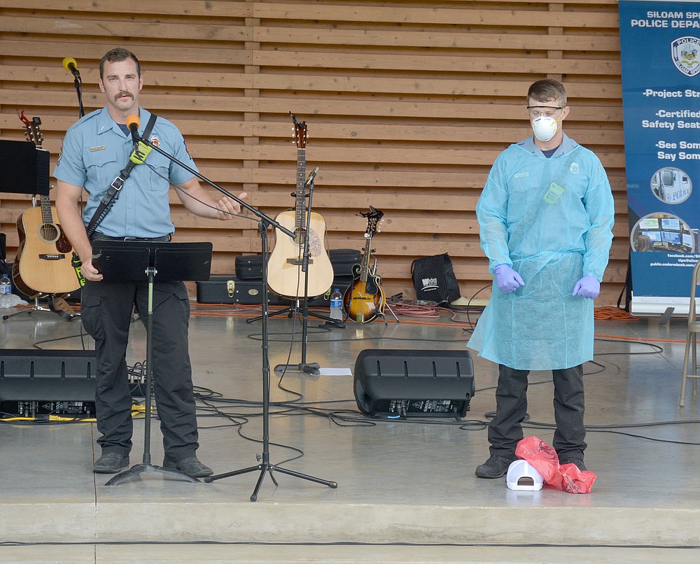 Graham Thomas/Herald-Leader
Siloam Springs Lt. Blake Osbourn (left) and firefighter Blake Alexander give a demonstration at the "Celebrating Siloam Springs First Responders" program Saturday hosted by the Siloam Springs Rotary Club at the Chautauqua Amphitheater in Memorial Park.