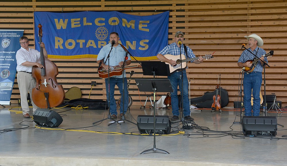 Graham Thomas/Herald-Leader
Band "About the Father's Business" plays at the "Celebrating Siloam Springs First Responders" program Saturday hosted by the Siloam Springs Rotary Club at the Chautauqua Amphitheater in Memorial Park.