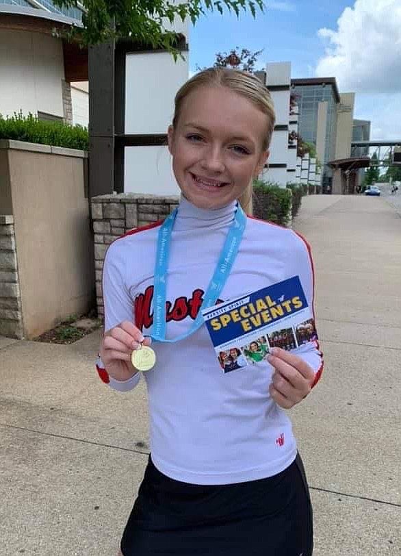 COURTESY PHOTO Kimbrough pictured with her All-American medal at the UDA dance camp. Kimbrough was the only MC Pom team member to try out.