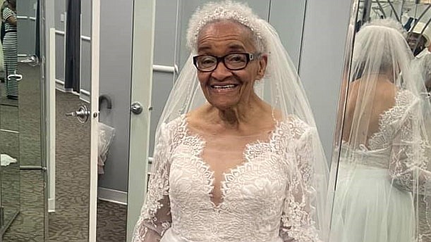 Martha Tucker, 94, tries on a wedding gown for the first time. Tucker always dreamed of wearing a traditional wedding gown, but when she got married in 1952, she was barred from entering bridal shops due to racial segregation. MUST CREDIT: Angela Strozier.