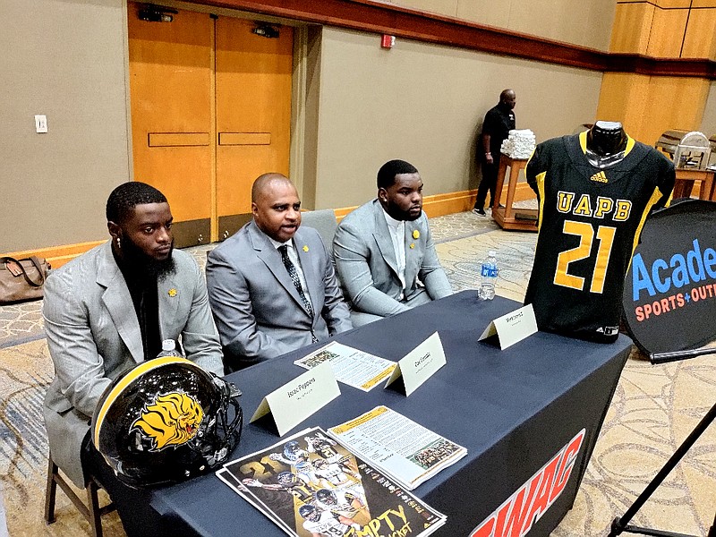 From left, UAPB linebacker Isaac Peppers, Coach Doc Gamble and offensive lineman Mark Evans II wait for questions during SWAC Media Day on Tuesday at the Sheraton Birmingham hotel in Birmingham, Ala. (Pine Bluff Commercial/I.C. Murrell)