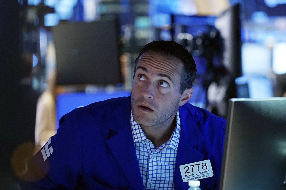 Specialist Michael Gagliano works at his post on the trading floor of the New York Stock Exchange, Tuesday, July 20, 2021. Stocks are opening higher on Wall Street Tuesday as investors shake off a rout a day earlier brought on by concerns about the spread of a more contagious variant of COVID-19. (AP Photo/Richard Drew)